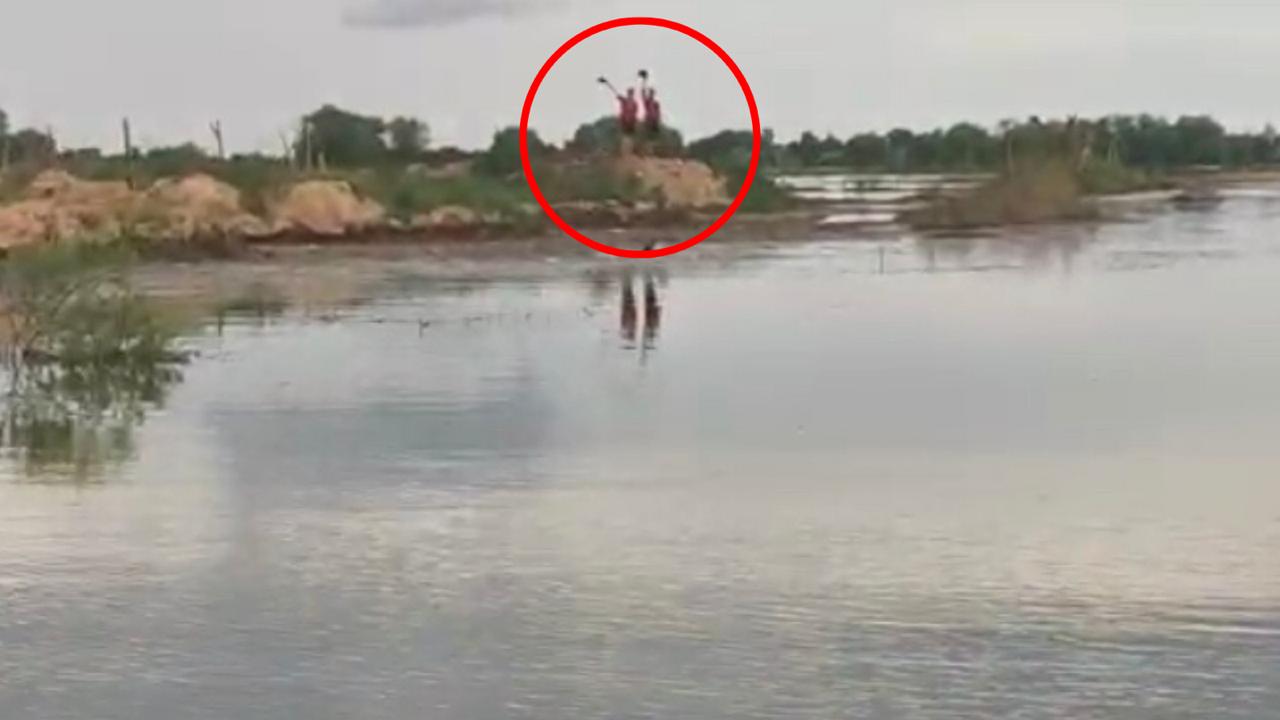 Police officers saved two villagers who remained in the flooded village
