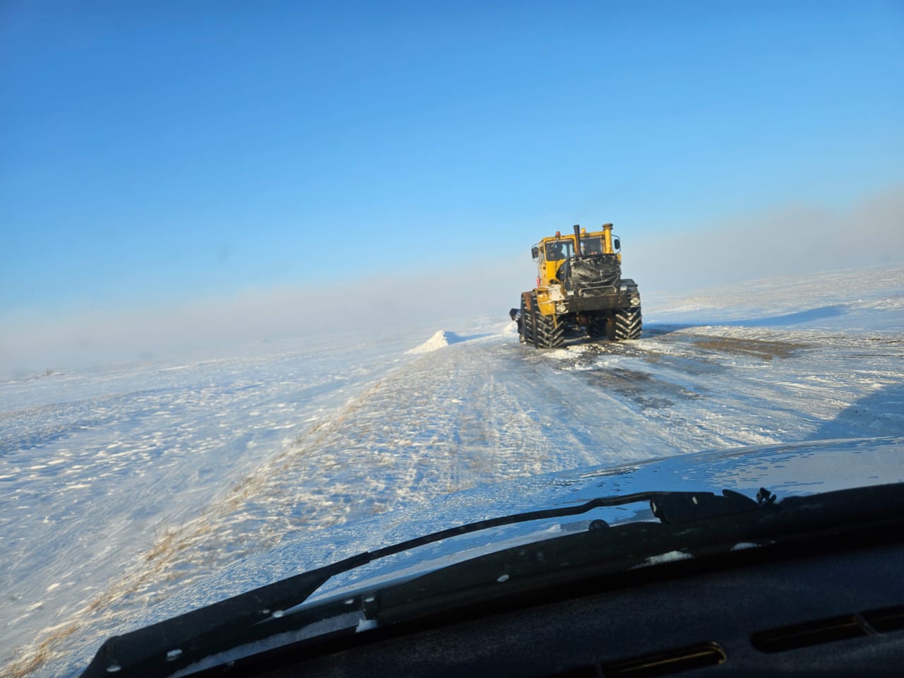 Қар үйінділерін тазалау жұмысы